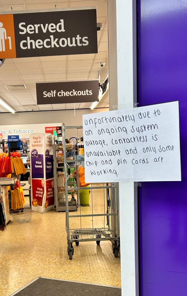 A hand written notice informing customers of technical issues at a Sainsbury’s store in Huddersfield