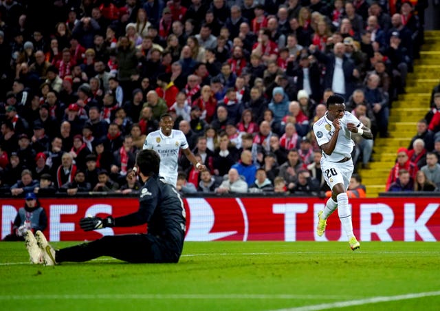 Vinicius Jr, right, celebrates scoring Real Madrid’s first goal at Anfield last season