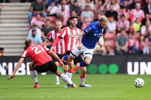 Southampton’s Charlie Taylor, left, and Adam Lallana bring down Ipswich’s Wes Burns