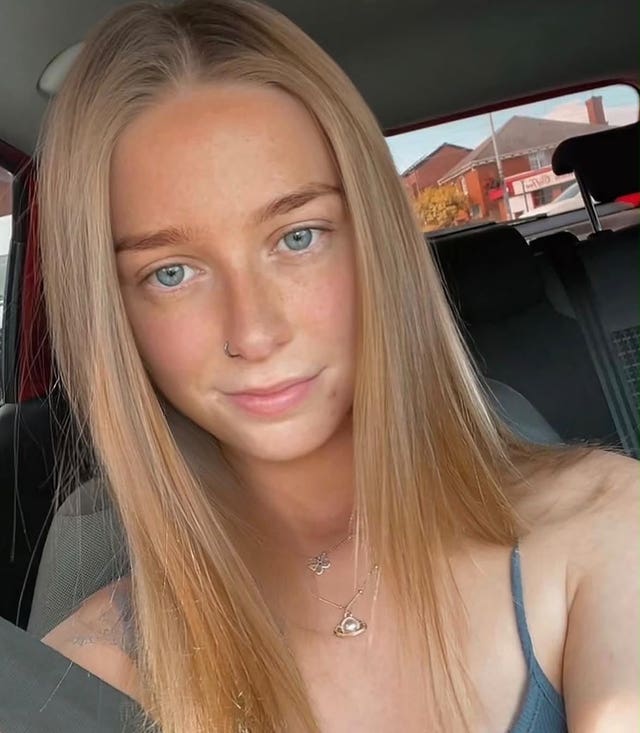 Handout photo of Raven Adams smiling, seated in a car