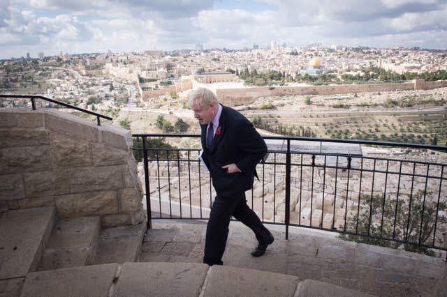 Boris Johnson looks out over the Old City of Jerusalem during a visit when he was mayor of London (Stefan Rousseau/PA)