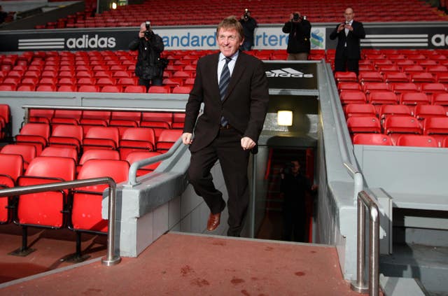 Kenny Dalglish emerges from the Anfield tunnel
