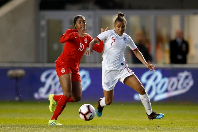 Canada’s Ashley Lawrence and England’s Nikita Parris battle for the ball 