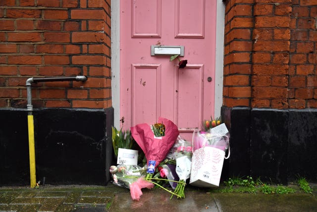 floral tributes placed outside Caroline Flack’s former home (Dominic Lipinski/PA)