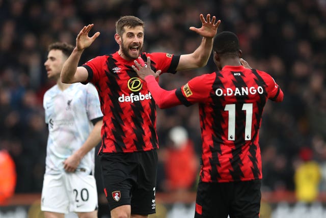 Bournemouth’s Jack Stephens, left, and Dango Ouattara celebrate victory over Liverpool