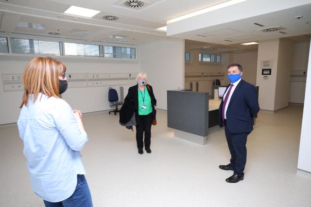 Robin Swann visiting a mass vaccination facility at the Ulster Hospital