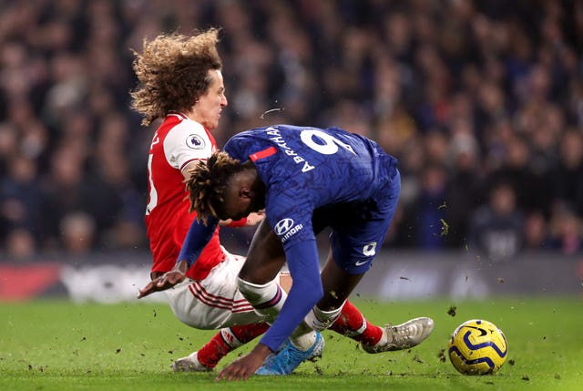 Tammy Abraham, right, is fouled by David Luiz for Chelsea's penalty
