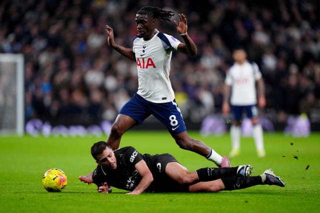 Yves Bissouma and Rodri battle for the ball 