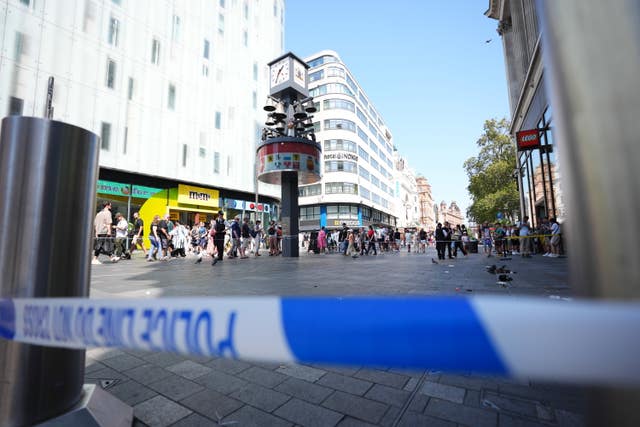 Police officers at the scene in Leicester Square