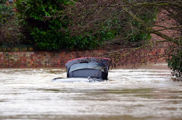 A vehicle is submerged under water near the River Devon, in Bottesford, Leicestershire