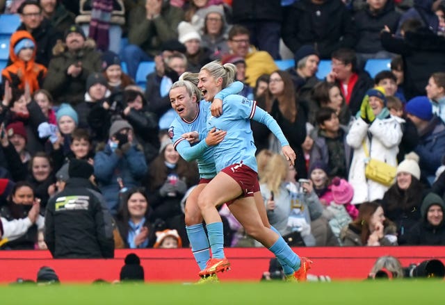 Coombs (right) celebrates after scoring in the derby in December (Tim Goode/PA)