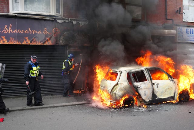 A car burns on Parliament Road, in Middlesbrough, during an anti-immigration protes