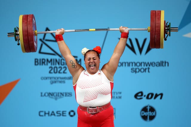 Emily Campbell grimaces as she lifts her weights .in action at the Commonwealth Games in Birmingham in 2022