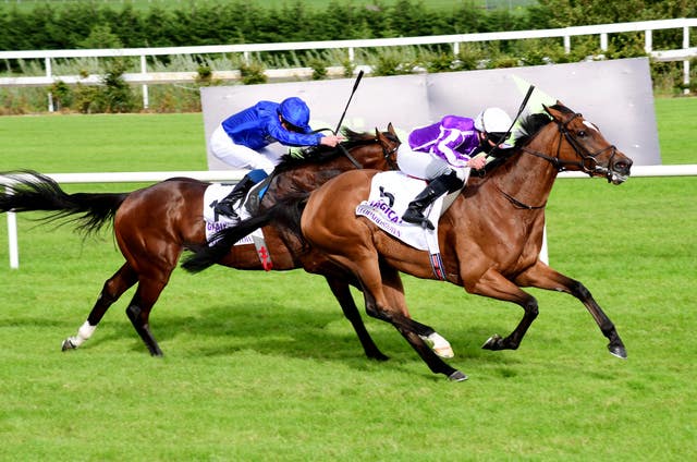 Magical, ridden by Seamus Heffernan, right, beats Ghaiyyath to win the Irish Champion Stakes at the Longines Irish Champions Weekend at Leopardstown