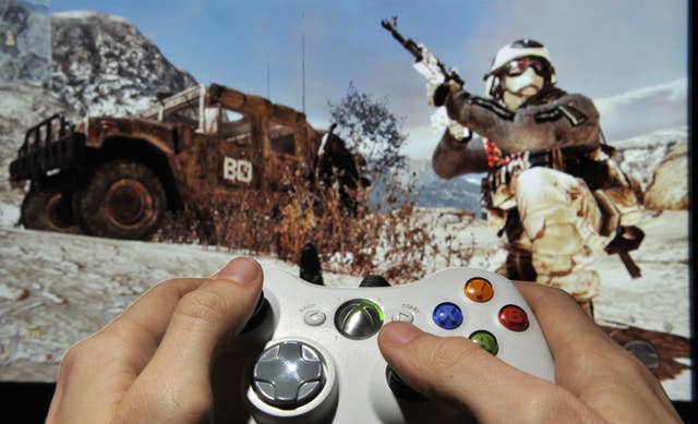 A person plays Call Of Duty Modern Warfare 2 on Microsoft's XBox 360