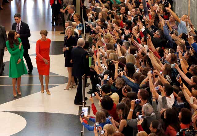 The Duchess of Cambridge waves as she arrives at the Parliament House in Canberra in 2014