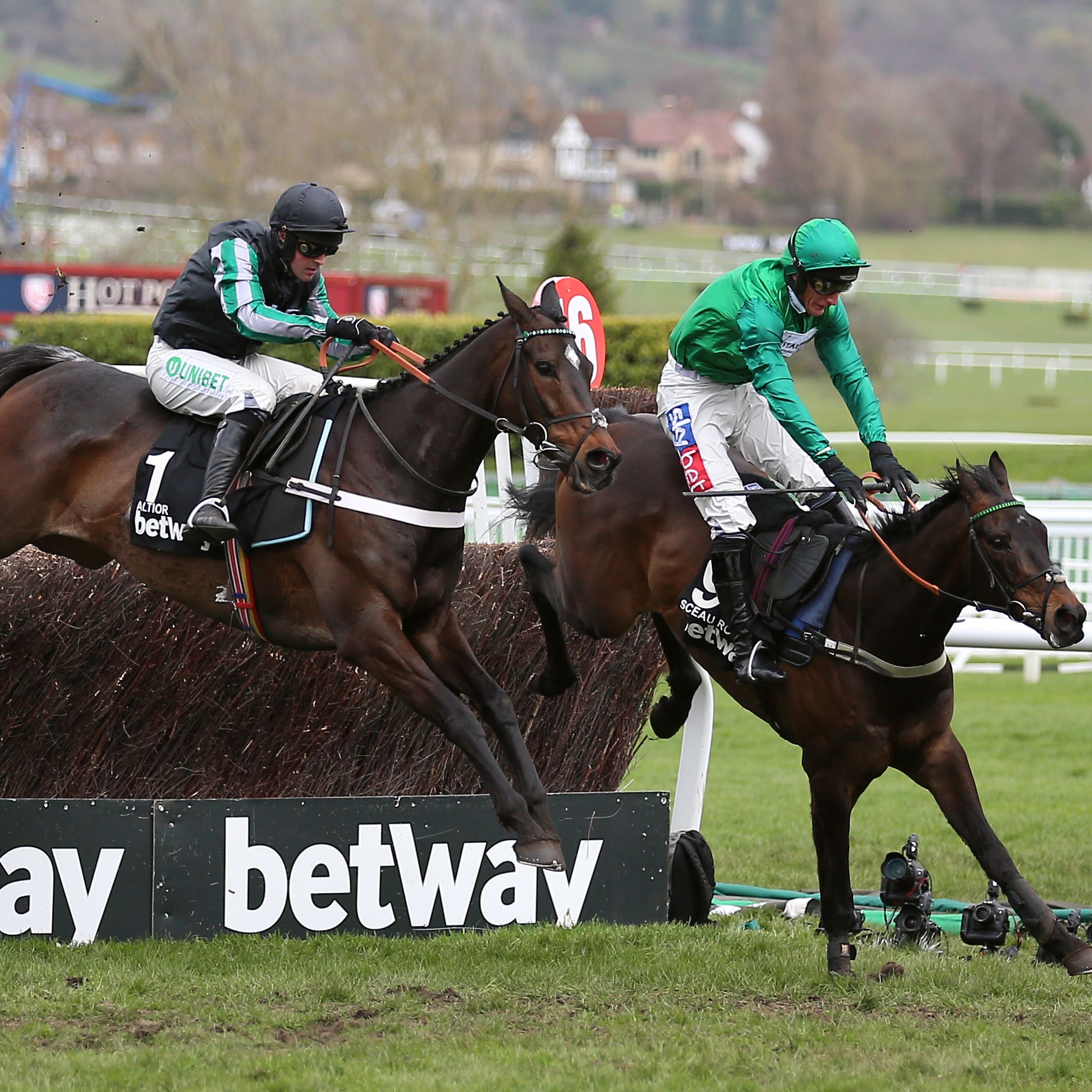 Altior and Nico de Boinville (left) had a fight on their hands on the way to a second successive Betway Queen Mother Champion Chase success