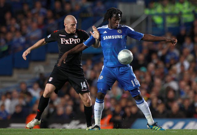 Fulham's Philippe Senderos (left) and Chelsea's Romelu Lukaku in action