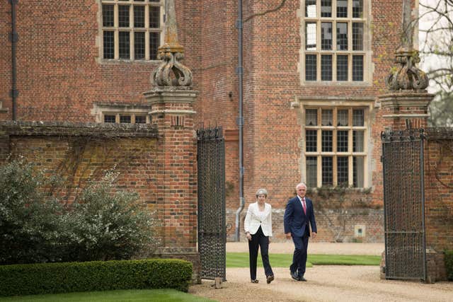 The two leaders  walked in the grounds of Mrs May's country residence (Aaron Chown/PA)