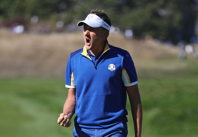 Ian Poulter celebrates during his win over Dustin Johnson