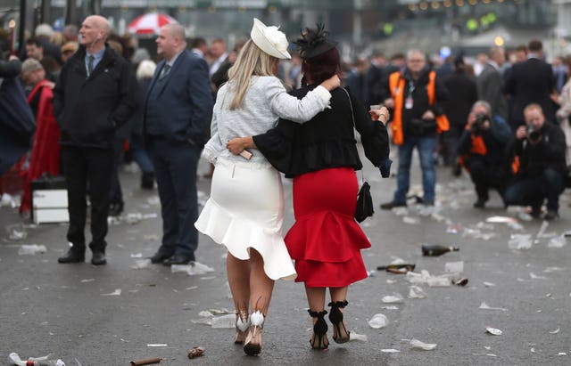 Racegoers are surrounded by rubbish as they leave the course on Ladies Day of the 2018 Randox Health Grand National Festival (David Davies/PA)