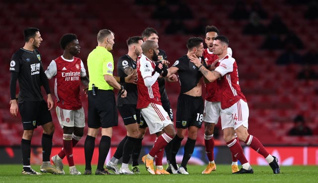 Arsenal midfielder Granit Xhaka, right, grabs Burnley's Ashley Westwood by the throat during a heated moment at Emirates Stadium. Xhaka was initially shown a yellow card for the incident before referee Graham Scott upgraded the punishment to a red after consulting the pitchside monitor. The Gunners slipped to a 1-0 loss against the Clarets, with manager Mikel Arteta claiming the indiscipline showed how committed his players were to addressing their Premier League slump