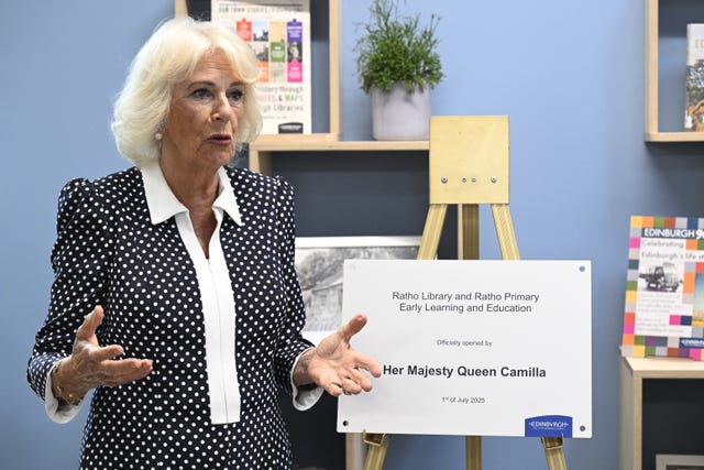 Camilla speaking beside a plaque marking her visit to Ratho Library