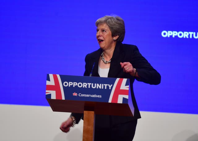 Prime Minister Theresa May danced as she arrives on stage to make her speech at the Conservative Party annual conference 