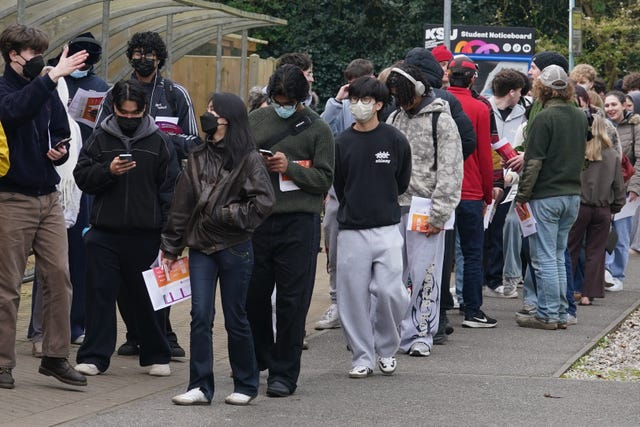 Students queuing to receive vaccines and antibiotics at the University of Kent campus in Canterbury