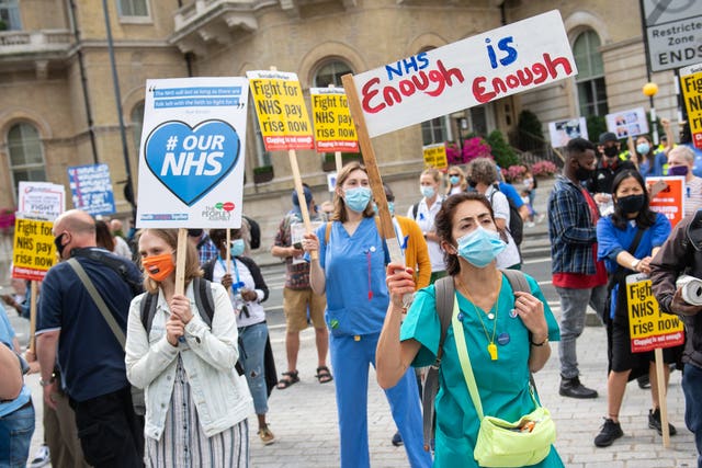 NHS staff and supporters take part in a protest march in central London 