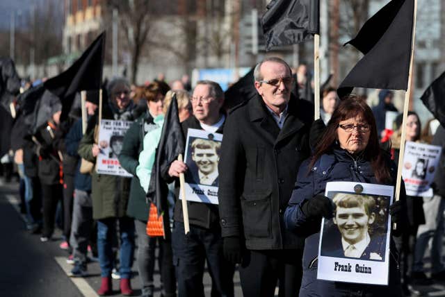 Relatives of people killed in Northern Ireland's Troubles marched with pictures of their loved ones (Brian Lawless/PA)