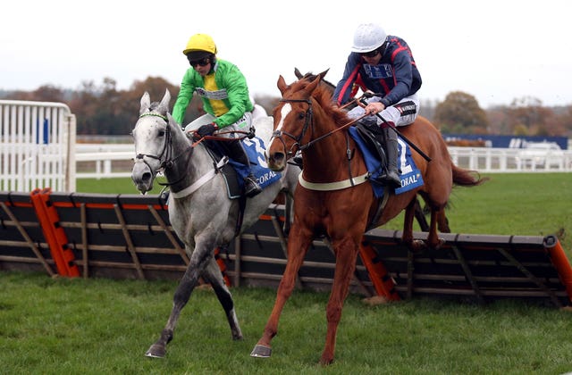 Buzz ridden by jockey Nico de Boinville (left) clear a fence on their way to winning the Coral Hurdle (Registered As The Ascot Hurdle) in 2021 