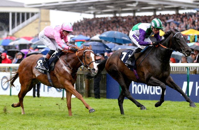 Live In The Dream (left) finishing second in the Palace House Stakes 