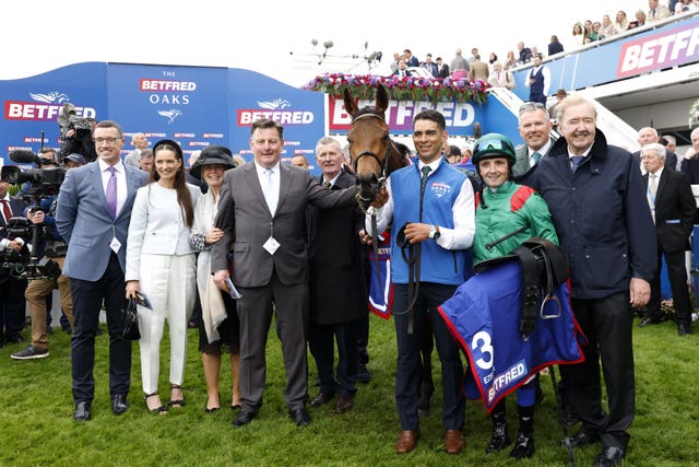 Dermot Weld and Chris Hayes with winning connections following the Oaks success of Ezeliya 