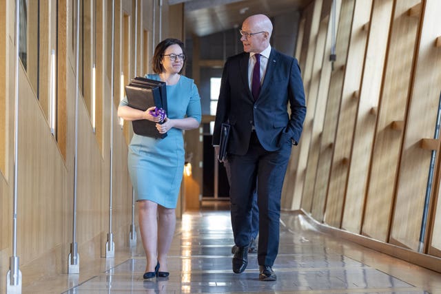 Kate Forbes and John Swinney walking to Holyrood chamber