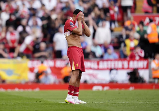 Liverpool’s Trent Alexander-Arnold stands dejected during the Premier League match