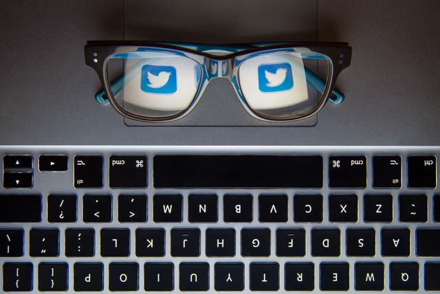 Twitter logo reflected in glasses
