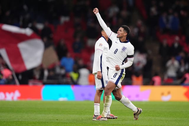 England midfielder Jude Bellingham punches the air after scoring against Greece