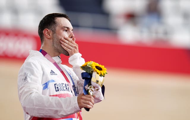 Matt Walls celebrates claiming Britain's first cycling gold of the Tokyo Games