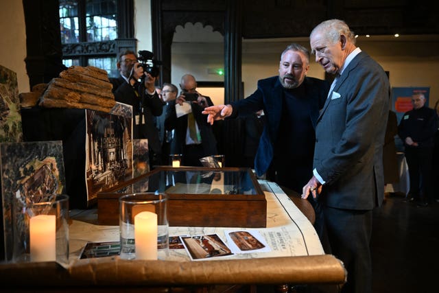 The King viewing artefacts in the Great Hall of Samlesbury Hall