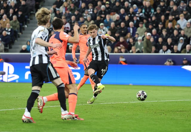 Harvey Barnes, right, scores Newcastle’s opener against Barcelona