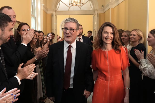 Newly elected Prime Minister Sir Keir Starmer with his wife Victoria Starmer enter his official London residence at No 10 Downing Street for the first time after the Labour Party won a landslide victory at the 2024 General Election. 