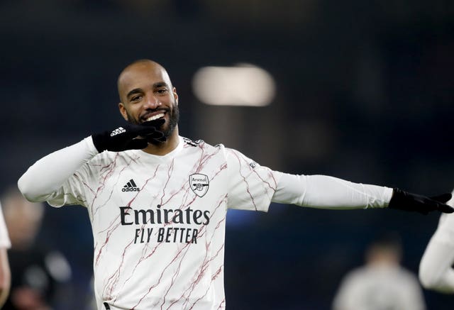 Lacazette celebrates his quick-fire goal from the bench 