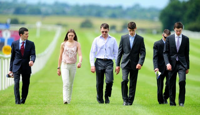 The O'Brien family walking the course at the Curragh 