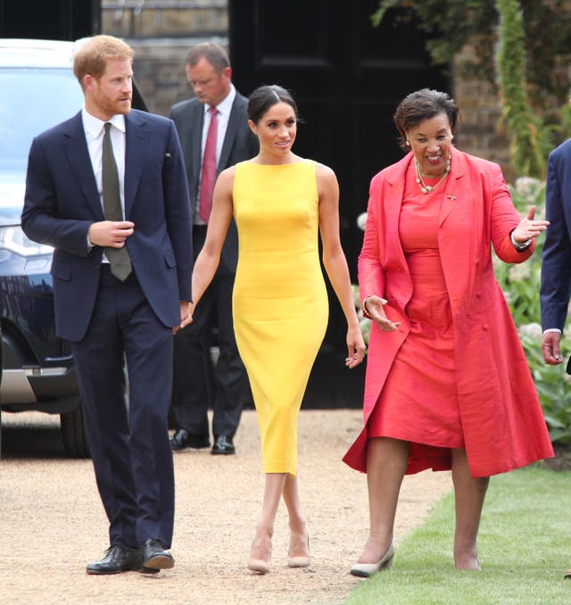 The Duke and Duchess of Sussex, with Baroness Scotland, arrive to attend the Your Commonwealth Youth Challenge reception at Marlborough House in London. Yui Mok/PA Wire