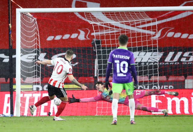 Billy Sharp's penalty took Sheffield United to the sixth round.