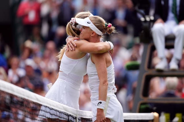 Katie Boulter (left) and Harriet Dart embrace at the net