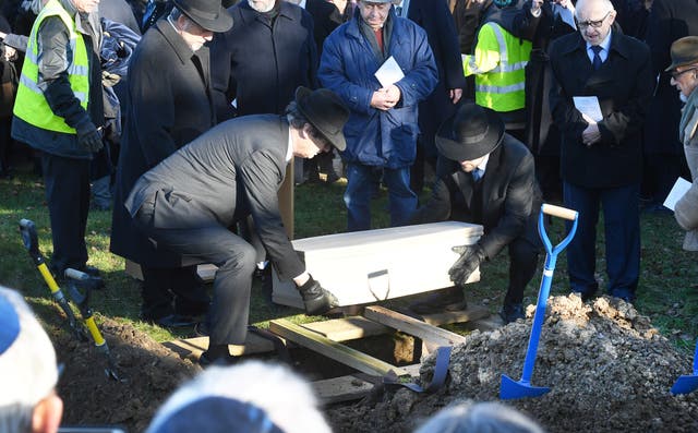 The coffin is buried at the United Synagogue New Cemetery