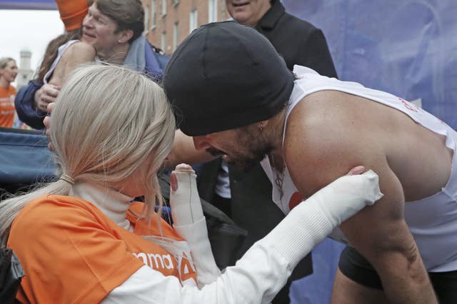 Farrell and Miss Fogarty hug on the finishing line 