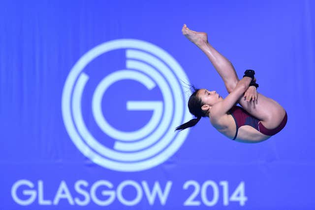 Diver diving past a Glasgow 2014 logo